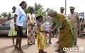 41st edition of United Nations Days in Oume: The Special Representative receives a warm welcome from a charming little girl on her arrival (Oume, December 2015)