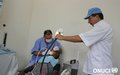 A dentist from UNOCI’s Moroccan Contingent treating a patient (Bouaké, January 2007)