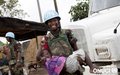 A little girl enjoying peacekeepers' presence during water distribution in Anyama, (February 2012)