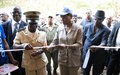 The Special Representative hands over the keys of a primary school and two hydraulic pumps rehabilitated in the village of Lebam by UNOCI