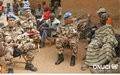 UNOCI peacekeeping patrols near Bouake (in Landonou): blue helmets talking with the village head (January 2007)