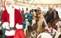 La délégation de l'ONUCI fait son entrée sur les lieux de la cérémonie ''Arbre de Noël 2015'' organisée en faveur d'enfants défavorisés (Abidjan, décembre 2015)