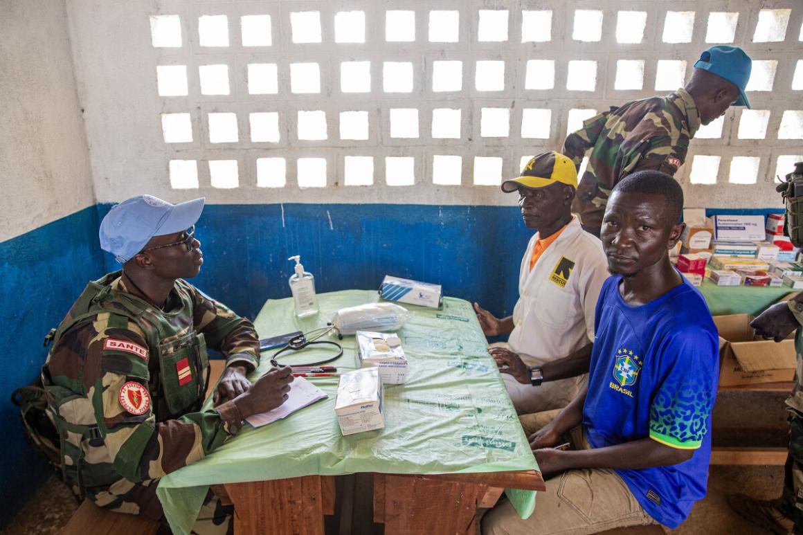 Individuals sit with a medical professional.